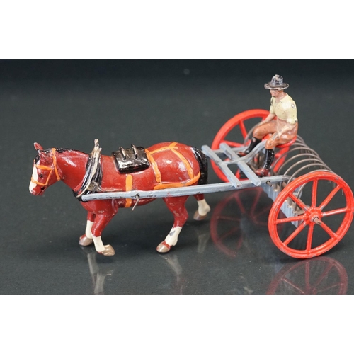 1067 - Four boxed Britains Home Farm Series metal models to include No 8F Horse Rake, No 20F Farmers Gig, N... 