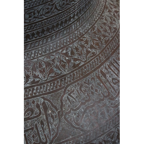 107 - Middle Eastern Large Copper Pot, hand beaten and scratch engraved with Islamic script and patterns, ... 