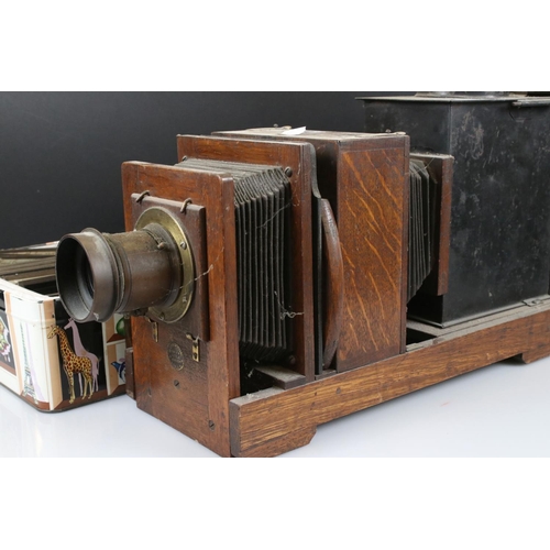 114 - Victorian Oak Magic Lantern together with over 90 Magic Lantern Slides including approximately 47 Sl... 