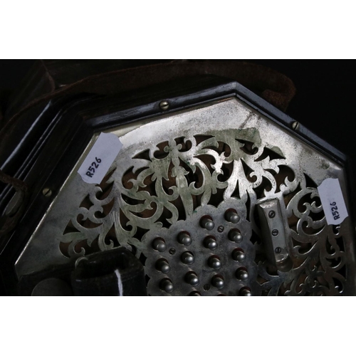 123 - An English Wheatstone & Co concertina, with fifty six metal buttons on foliate pierced metal, No.276... 