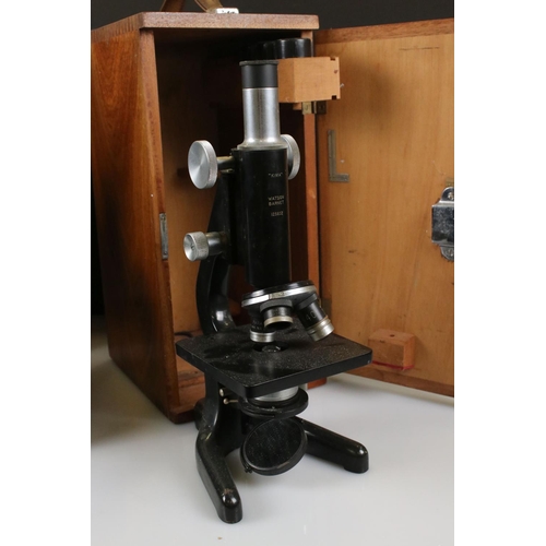 124 - Two Watsons microscopes in original wooden carry cases to include a Watson Barnet “KIMA” microscope ... 