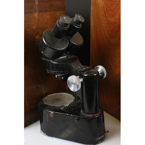 124 - Two Watsons microscopes in original wooden carry cases to include a Watson Barnet “KIMA” microscope ... 