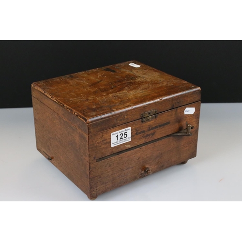 125 - An antique German wooden cased music box complete with nine metal discs.