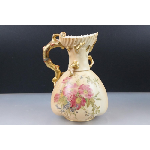 13 - Pair of Royal Worcester Blush Ivory Jugs, decorated with flowers and with gilt moulded handles in th... 