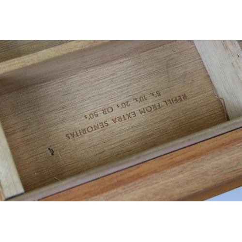 130 - A shop display cigar cabinet with hinged glass lid.