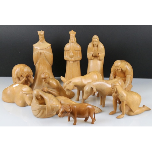 143 - Eleven Hand Carved Sycamore Nativity Figures and Animals, tallest 28cm together with one other piece