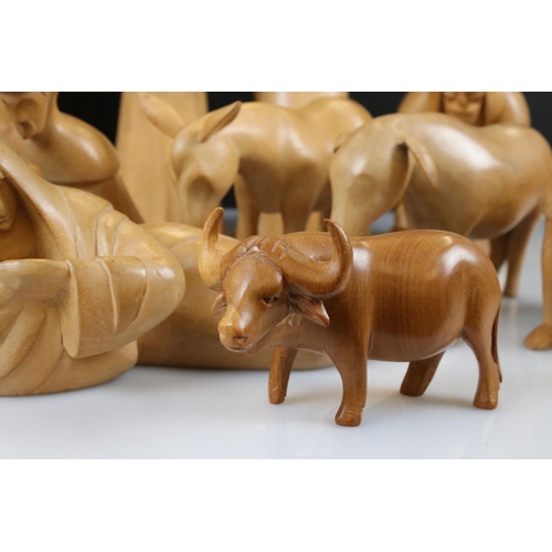 143 - Eleven Hand Carved Sycamore Nativity Figures and Animals, tallest 28cm together with one other piece