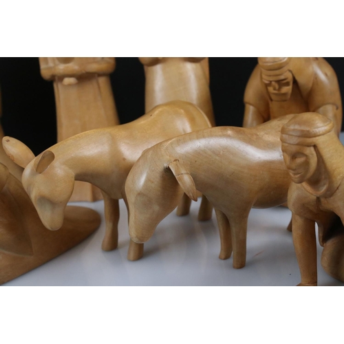 143 - Eleven Hand Carved Sycamore Nativity Figures and Animals, tallest 28cm together with one other piece