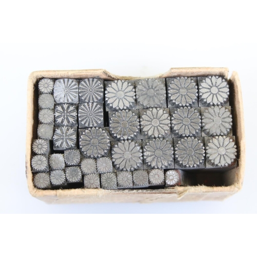 152 - A collection of metal ink stamps with circular patterned decoration.