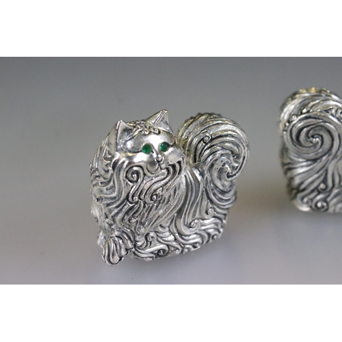 158 - Pair of silver plated condiments in the form of cats with emerald eyes