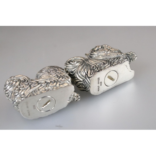 158 - Pair of silver plated condiments in the form of cats with emerald eyes