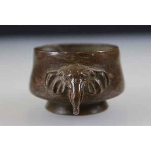 164 - Bronze footed bowl with elephant head handles, signed with character marks to underside, approx. dia... 