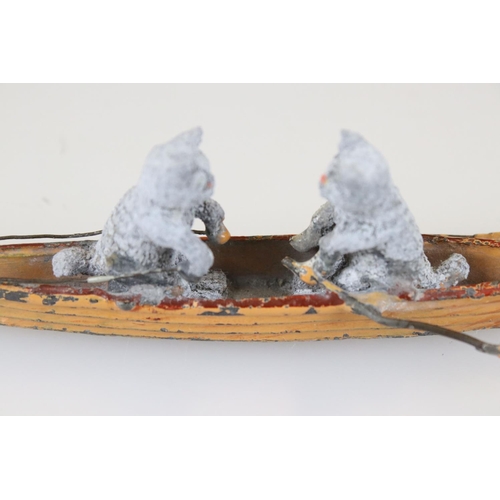 165 - An antique Austrian cold painted ornament depicting two cats rowing a skiff.