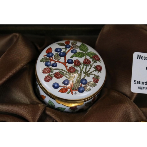 176 - A cased set of three English enamel on copper pill boxes by Crummles in fitted display box.