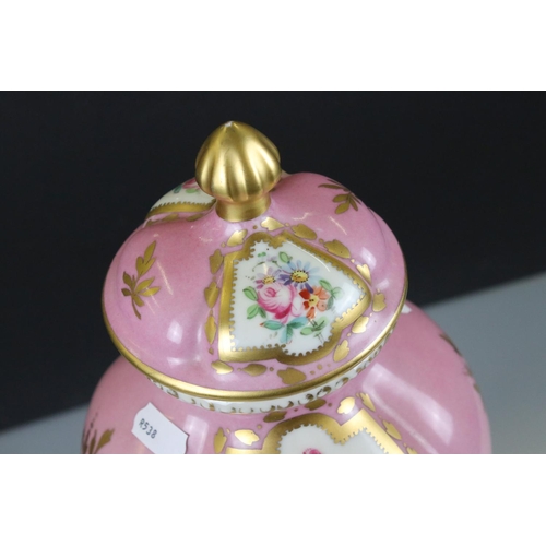 18 - 19th century Continental Porcelain Pink Ground Lidded Urn decorated with panels of flowers in a bask... 