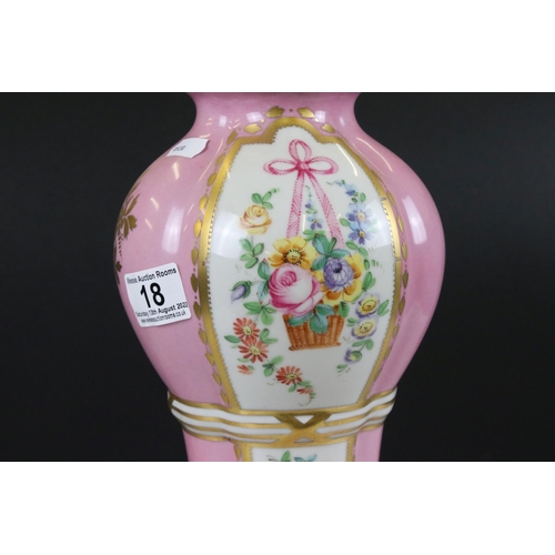 18 - 19th century Continental Porcelain Pink Ground Lidded Urn decorated with panels of flowers in a bask... 