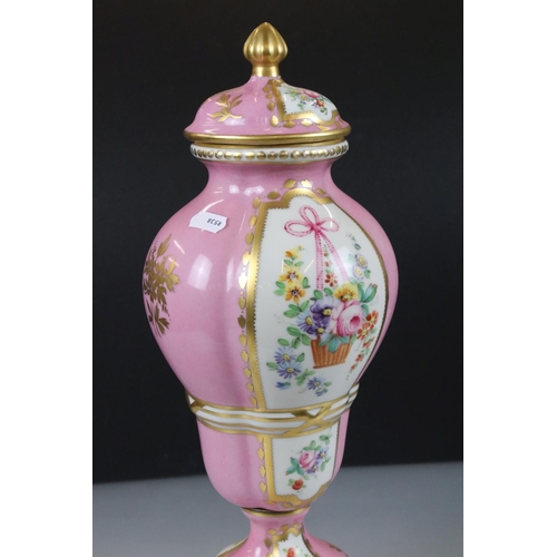 18 - 19th century Continental Porcelain Pink Ground Lidded Urn decorated with panels of flowers in a bask... 