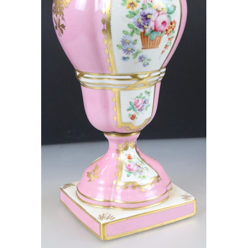 18 - 19th century Continental Porcelain Pink Ground Lidded Urn decorated with panels of flowers in a bask... 