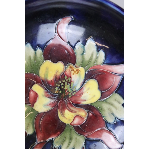 2 - Moorcroft Pottery Bowl decorated in the columbine pattern on a blue ground, label to base, 14cm diam... 