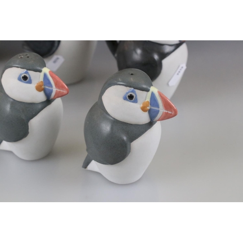 27 - John O'Groats Pottery - Set of Three Graduating Puffin Jugs, largest 20cm high together with another... 