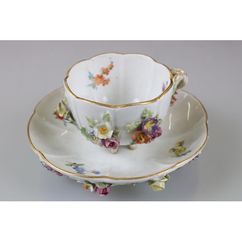 28 - Meissen Porcelain Cabinet Cup and Saucer, floral encrusted and painted with flowers, blue cross swor... 