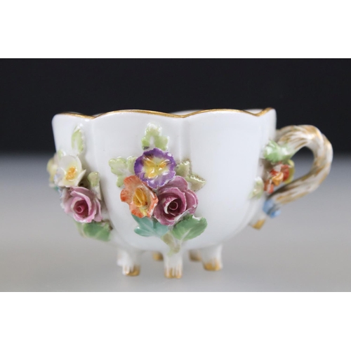 28 - Meissen Porcelain Cabinet Cup and Saucer, floral encrusted and painted with flowers, blue cross swor... 