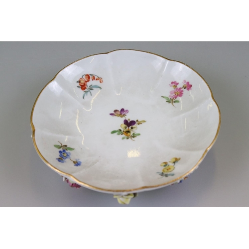 28 - Meissen Porcelain Cabinet Cup and Saucer, floral encrusted and painted with flowers, blue cross swor... 