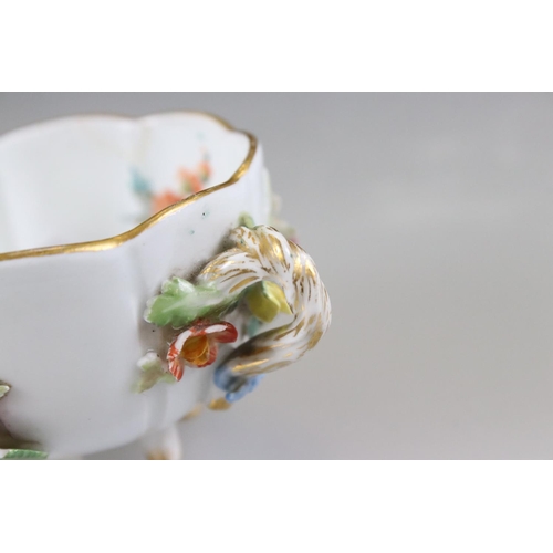 28 - Meissen Porcelain Cabinet Cup and Saucer, floral encrusted and painted with flowers, blue cross swor... 