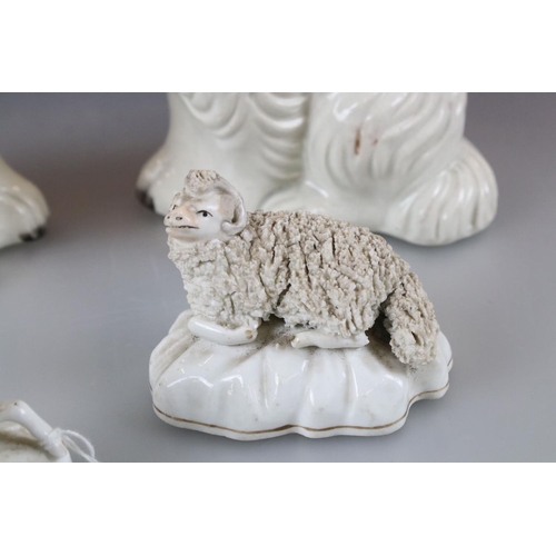 29 - Two antique Staffordshire spaniels, together with pair of similar 19th century sheep