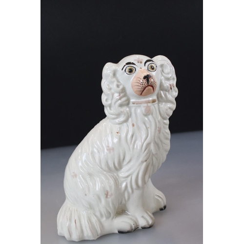 29 - Two antique Staffordshire spaniels, together with pair of similar 19th century sheep