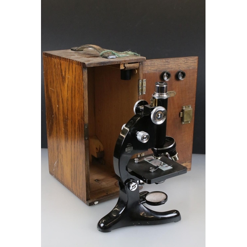 331 - A Beck Ltd of London model 29 microscope, serial no.13487, complete with lenses and original fitted ... 