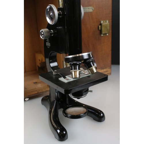 331 - A Beck Ltd of London model 29 microscope, serial no.13487, complete with lenses and original fitted ... 