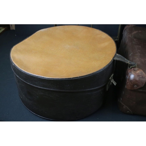 337 - Two vintage brown leather suitcases together with a hat box.