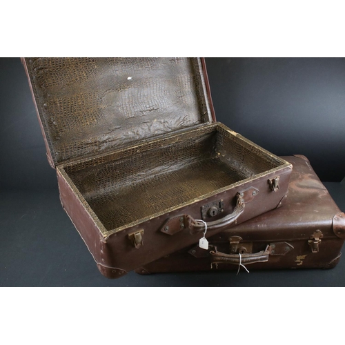 337 - Two vintage brown leather suitcases together with a hat box.