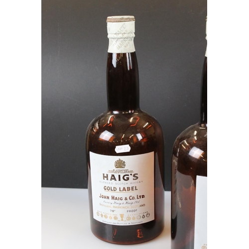 338 - A pair of Haig Whisky gold label shop display bottles, approx 40cm in height.