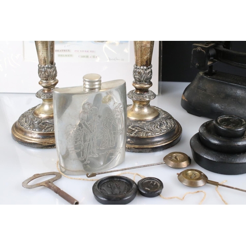 341 - A box of mixed collectables to include kitchen scales, hip flask, candlesticks and a mounted print.