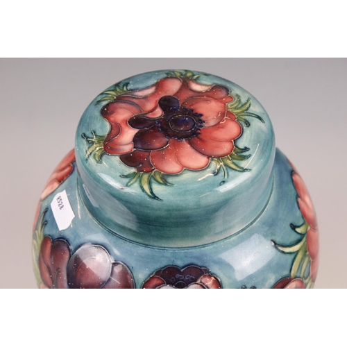 4 - Walter Moorcroft Pottery Ginger Jar and Lid decorated in the Anemone pattern on a green ground, 21cm... 