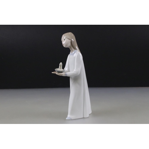 43 - Lladro Figurine of a Girl carrying a chamber stick, 21cm high