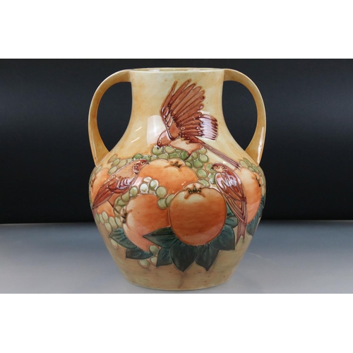 5 - Moorcroft Large Twin Handled Vase decorated in the Fruits and Finches pattern on Ochre ground, impre... 