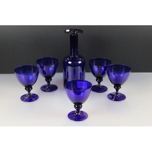 52 - Bristol Blue style Glass Carafe, 25cm high together with five matching Wine Glasses