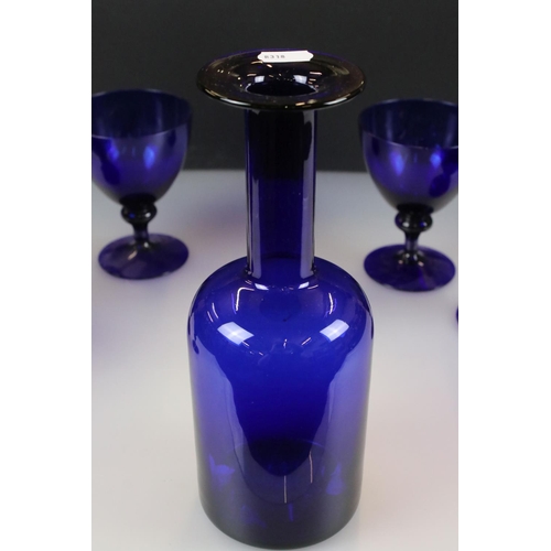 52 - Bristol Blue style Glass Carafe, 25cm high together with five matching Wine Glasses