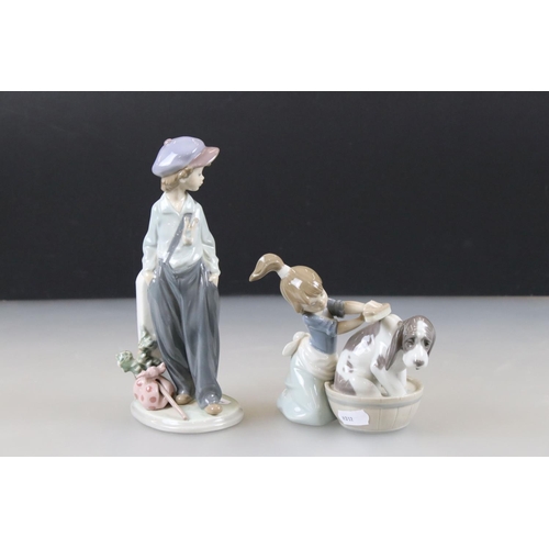 54 - Two Lladro Models including Boy with Knapsack, 21cm high and ' Bashful Bather ' model 5455