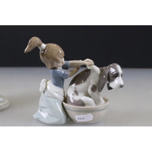 54 - Two Lladro Models including Boy with Knapsack, 21cm high and ' Bashful Bather ' model 5455