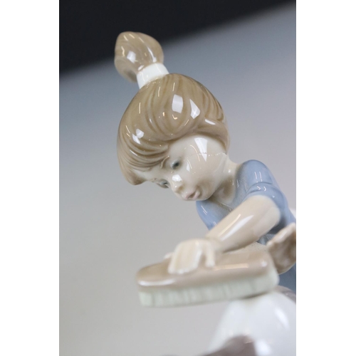 54 - Two Lladro Models including Boy with Knapsack, 21cm high and ' Bashful Bather ' model 5455