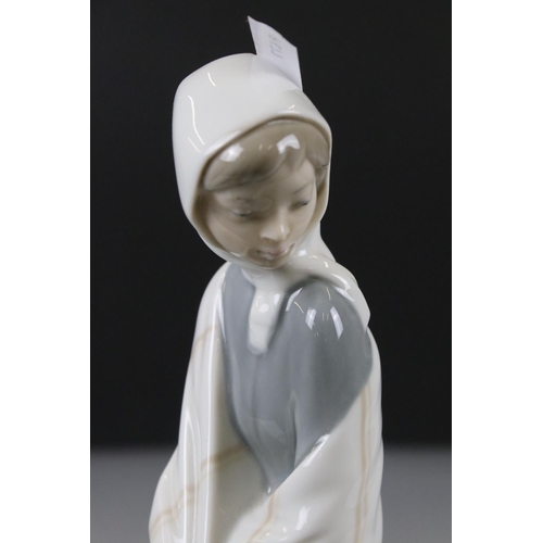 55 - Lladro Figurine of a Girl sat on a tree stump with picnic basket and bird, 26cm high