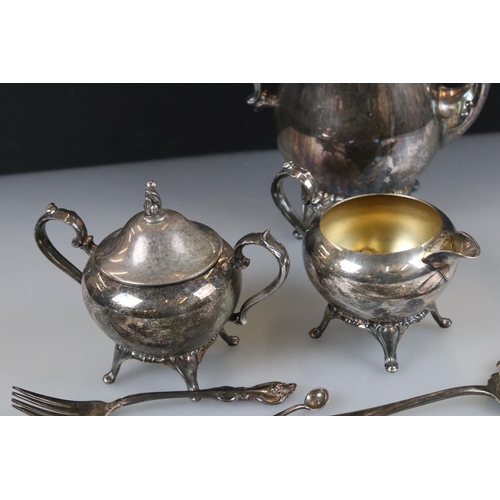 82 - A small collection of mixed silver plate to include coffee pot, jug, sugar bowl, cutlery...etc.