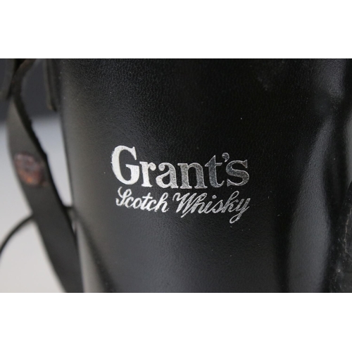 87 - Grant's Scotch Whiskey Black Leather Case fitted with three glass whiskey flasks