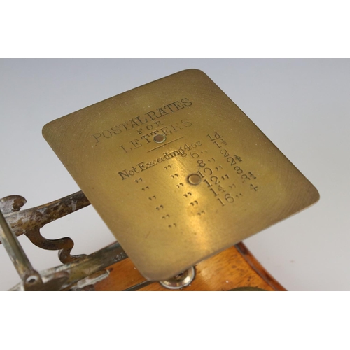 95 - Set of Victorian Brass Postal Scales with Six Weights on a Wooden Plinth Base, 25cm long