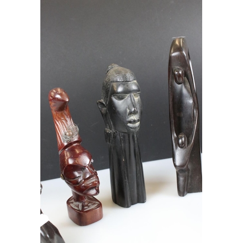 343 - A small collection of wooden and stone tribal carvings.