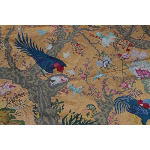 348 - A large hanging tapestry of exotic birds with floral background.